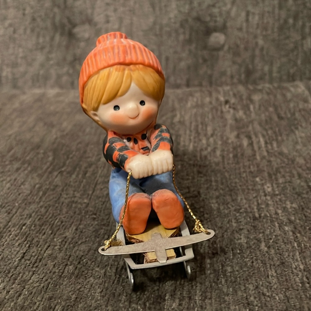 Enesco Country Cousins Katie On a Sled